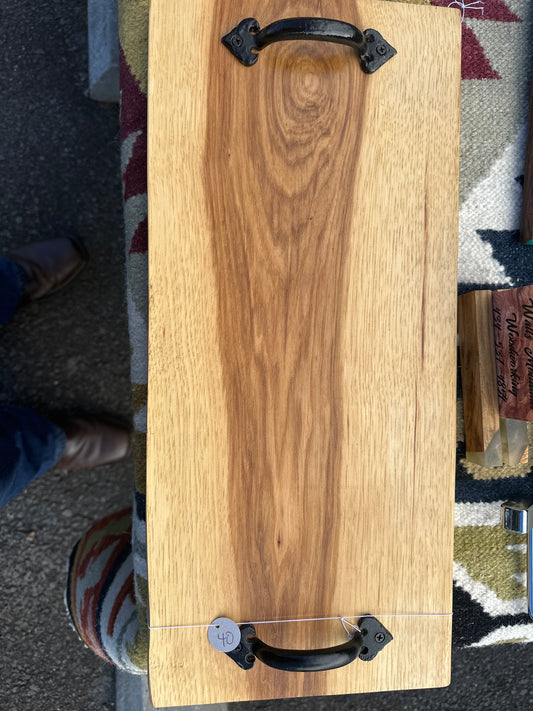 Hickory cutting board with handles.